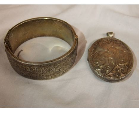 SILVER ENGRAVED BANGLE AND LARGE OVAL ENGRAVED LOCKET
