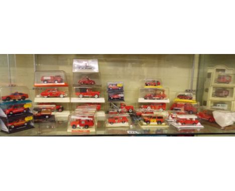 SHELF OF SOLIDO PERSPEX BOXED FIRE ENGINES AND MAJORETTE 1/43 SCALE MODELS