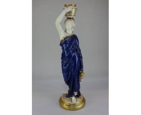 A Royal Worcester porcelain figure of a water carrier, with blue and gilt decoration, on a circular base, shape number 2/125,