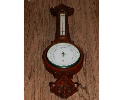 A 20th century oak cased wheel barometer. L: 84cm