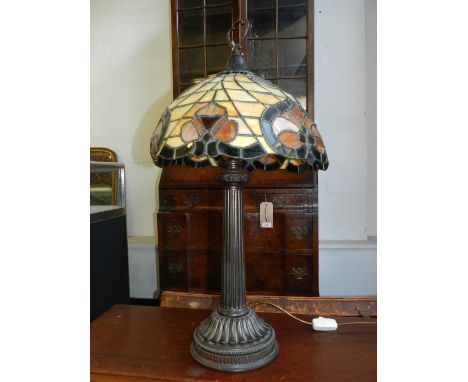 A 20th century stained glass table lamp, in the Tiffany style. H: 79cm 