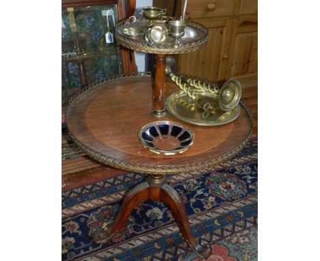 A Louis XV style mahogany dumbwaiter, having reeded column supports, raised on tripod legs. H.94cm D.71cm