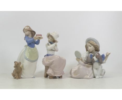 One Lladro and two Nao Figures of a girl holding a cake and two girls with puppies (3)