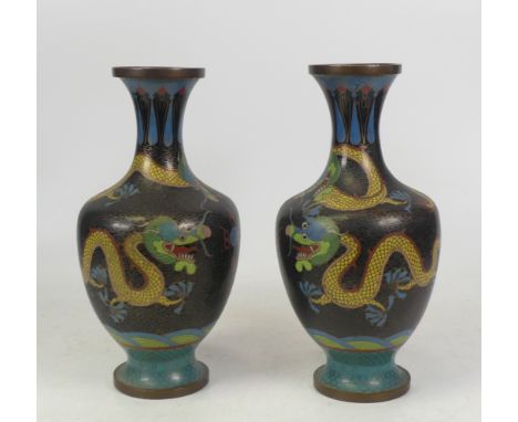 Pair of Chinese Oriental Cloisonne Vases. Images of four toed dragons. Some damage/dents to enamel. Height: 23cm (2)