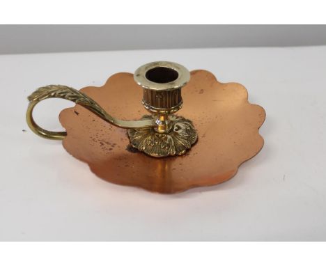 An antique copper &amp; brass chamber stick 