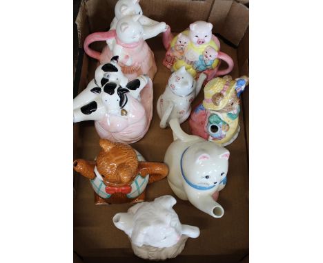 A box full of novelty ceramic teapots 