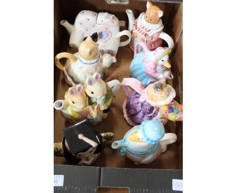 A box full of novelty ceramic teapots 
