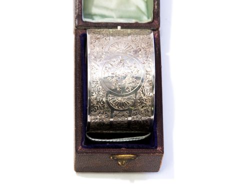 An Aesthetic Movement American silver bracelet, bangle style, engraved with birds and blossom, circa 1880, stamped sterling, 