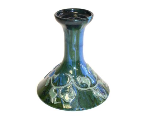 Sir Edmund Harry Elton, an Elton Ware, Arts and Crafts pottery candlestick, of conical form with relief moulded stylised flor