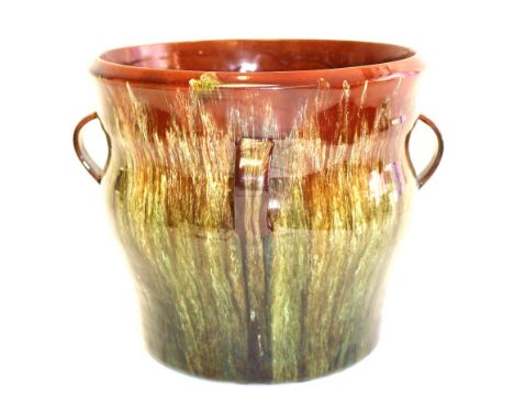 Christopher Dresser for Linthorpe, an art pottery jardiniere, circa 1880, double ogee cylindrical form with four loop handles