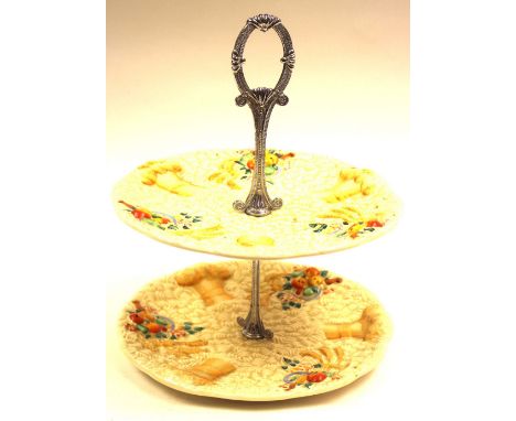 Clarice Cliff, a Celtic Harvest two tier cake stand, moulded fruit and wheat design, with chrome handle, Newport Pottery mark