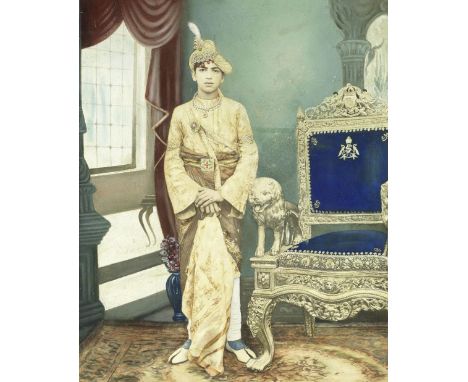 INDIA - PRINCELY RULERLarge portrait of an unidentified youthful princely ruler, standing full-length wearing rich jewellery 