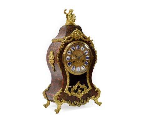 &lt;&gt; A Tortoiseshell and Brass Inlaid Striking Mantel Clock, retailed by LeRoy A Paris, circa 1890, surmounted by a seate