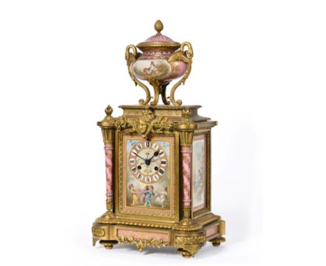 A Gilt Metal Pink Porcelain Mounted Striking Mantel Clock, circa 1890, surmounted by a swan handled pink porcelain urn finial