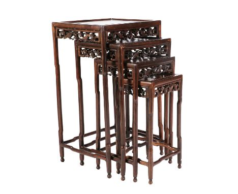 A Quartetto Nest of Chinese Hardwood Tables, early 20th century, of graduated rectangular form with moulded tops, each decora