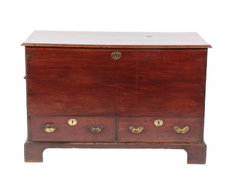 ~ A George III Mahogany Chest, 2nd half 18th century, the moulded hinged lid with re-entrant corners enclosing a vacant inter