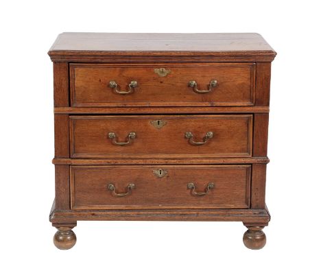 &lt;&gt; A Late 17th Century Oak Straight Front Chest of Drawers, the moulded top above three conforming drawers and moulded 