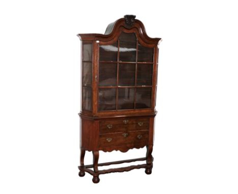 A Dutch Walnut Display Cabinet, in 17th century style, the moulded top above glazed doors enclosing two fixed shelves with tw