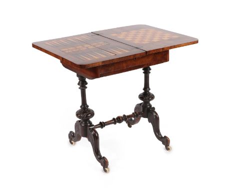 A Victorian Figured Walnut Work/Games Table, circa 1880, the pivoting top with Tunbridgeware mosaic view of Eridge Castle wit