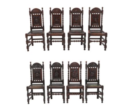 Eight Carved Oak Dining Chairs, late 19th/early 20th century, with close-nailed and painted leather seats, comprising four ex