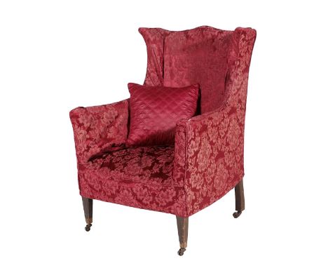 ~ A Mid 19th Century Wing-Back Chair, with removable red cover, covered in light green fabric decorated with a woodland scene