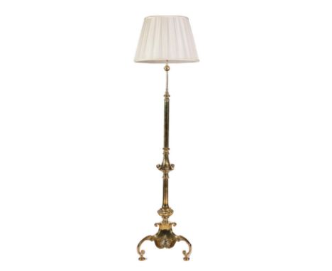 A Brass Stylised Standard Lamp, late 19th century, on a column support with knopped base and anthemion shaped base with three