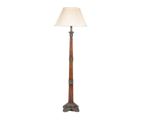 &lt;&gt; A Regency Style Mahogany and Gilt Metal Mounted Standard Lamp, the tapered fluted column support with acanthus scrol