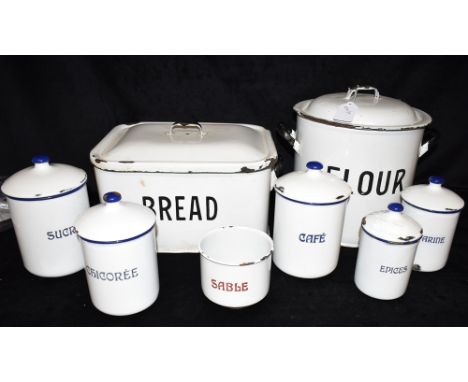 A GROUP OF ENAMEL WARES  including a flour bin and bread bin, and a group of French jars for Sucre, Cafe, Epices, Chicoree, F
