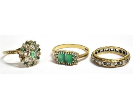 THREE 9CT GOLD RINGS  Comprising a green and crystal stone set cluster ring (two clear stones missing) ring size O, a green t