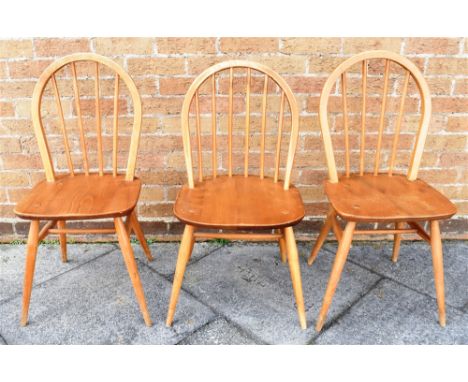 A PAIR OF LIGHT ERCOL STICKBACK DINING CHAIRS  together with another similar (3) Condition Report : joints a bit loose, other