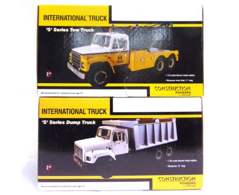 TWO 1/25 SCALE FIRST GEAR CONSTRUCTION PIONEERS DIECAST MODEL VEHICLES comprising an International S Series Tow Truck 'Intern