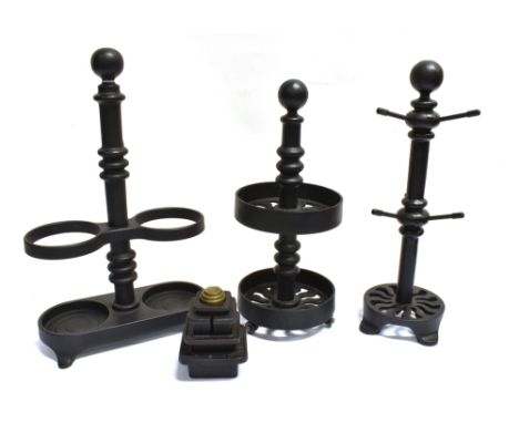 ROBERT WELCH FOR VICTOR:  four cast iron items comprising a two bottle stand, mug tree, two tier circular spice rack and a gr