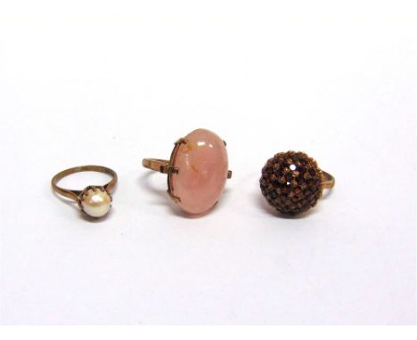 A 9 CARAT GOLD ROSE QUARTZ DRESS RING with a 9 carat gold cluster ring; and a 9 carat gold cultured pearl ring; 15.6g gross