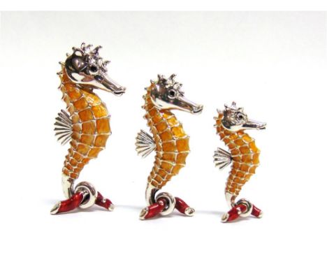 SATURNO, ITALY: A GRADUATED SET OF THREE SILVER AND ENAMEL SEAHORSES,  the largest approx 65mm high