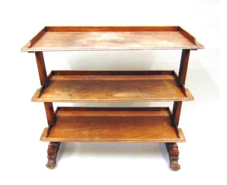 A VICTORIAN MAHOGANY THREE TIER BUFFET,  each tier with three-quarter gallery and moulded edge, on acanthus carved supports w