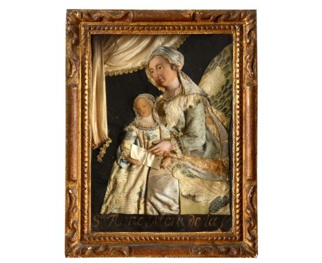 A LOW-RELIEF RELIGIOUS PORTRAIT OF ST. ANNE, MOTHER OF THE VIRGIN MARY depicting her seated beside her daughter, their heads 