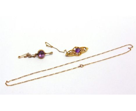 AN AMETHYST AND SEED PEARL BROOCH stamped '15ct', 4.1cm long, 3.6g gross; with an amethyst bar brooch; and a figaro link chai