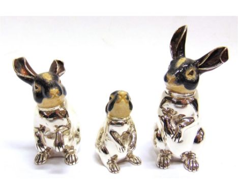 SATURNO, ITALY: A GRADUATED SET OF THREE SILVER AND ENAMEL HARES,  the largest approx 90mm tall  