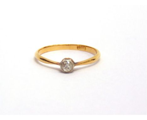 A SINGLE STONE DIAMOND RING stamped '18ct', the old cut approximately 0.1 carats, finger size K, 1g gross 