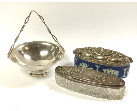 A small Chinese silver basket with mark WH for Wang Hing together with 2 silver topped dressing trinket pot.
