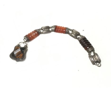 A silver and enamel bracelet.Postage B
