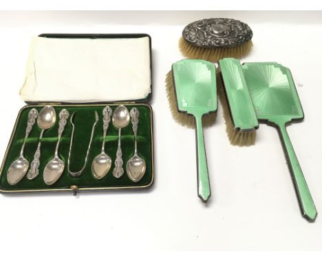 A cased set of silver spoons and a silver and enamel dressing table set.Postage B