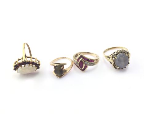 Four 9ct gold rings set was assorted stones including opal. 17.07g Postage B