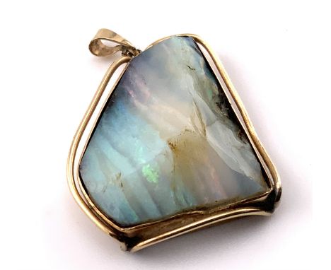 A 9ct gold mounted opal (cross section). 25mm x 21mm. (A) 7.98g.