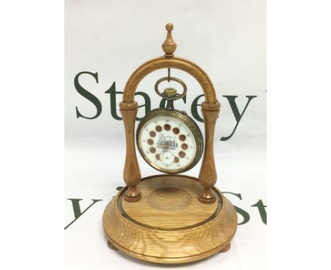 Railway interest. An oversized French brass and base metal pocket watch with decorative enamel roundels and an image of a ste