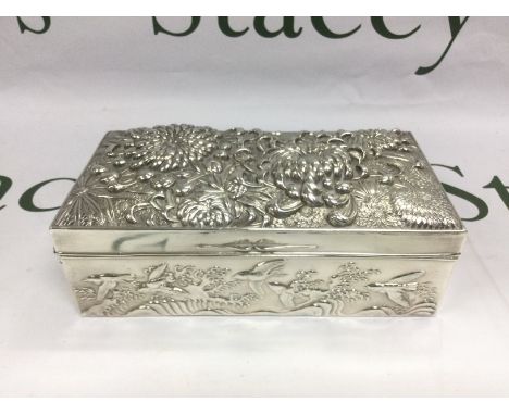 A heavy Oriental white metal trinket box, heavily embossed, slight damage to hinge, approx 900g. Shipping category B.