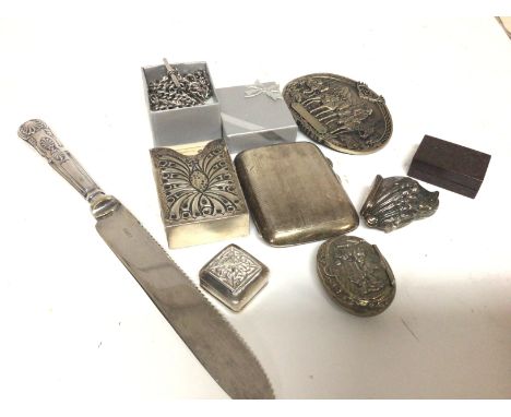 A collection of silver oddments a card case watch chains snuff box cigarette case and other oddments