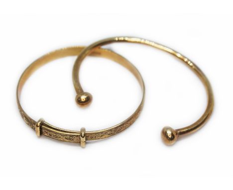 A hallmarked 9ct gold baby bangle and another unmarked (tests as 9ct), gross wt. 11.7g.  