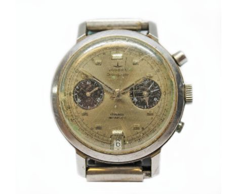 A Dugena stainless steel chronograph wristwatch, circa 1970, diam. 38mm, silvered dial with two black subsidiaries, manual wi