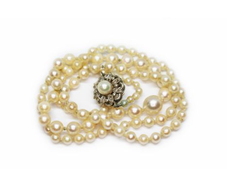 A graduated cultured pearl necklace, 9ct white gold diamond and pearl set clasp, sponsor 'C&amp;F', Birmingham  1981, length 